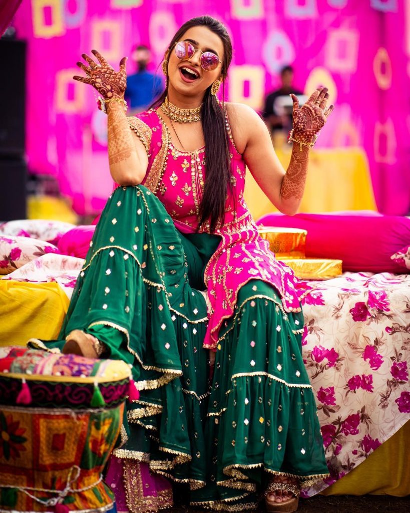 fun laughing bride in 90s green mehndi sharara outfits