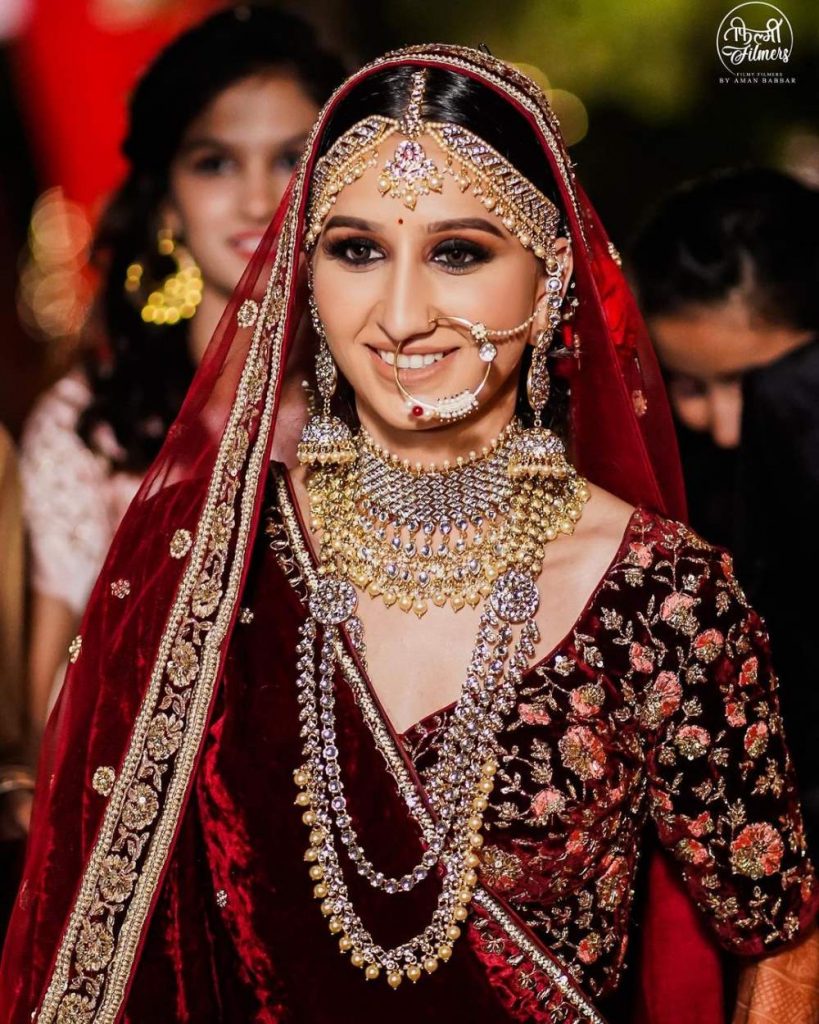 matching gold lehenga accessories with maroon lehenga