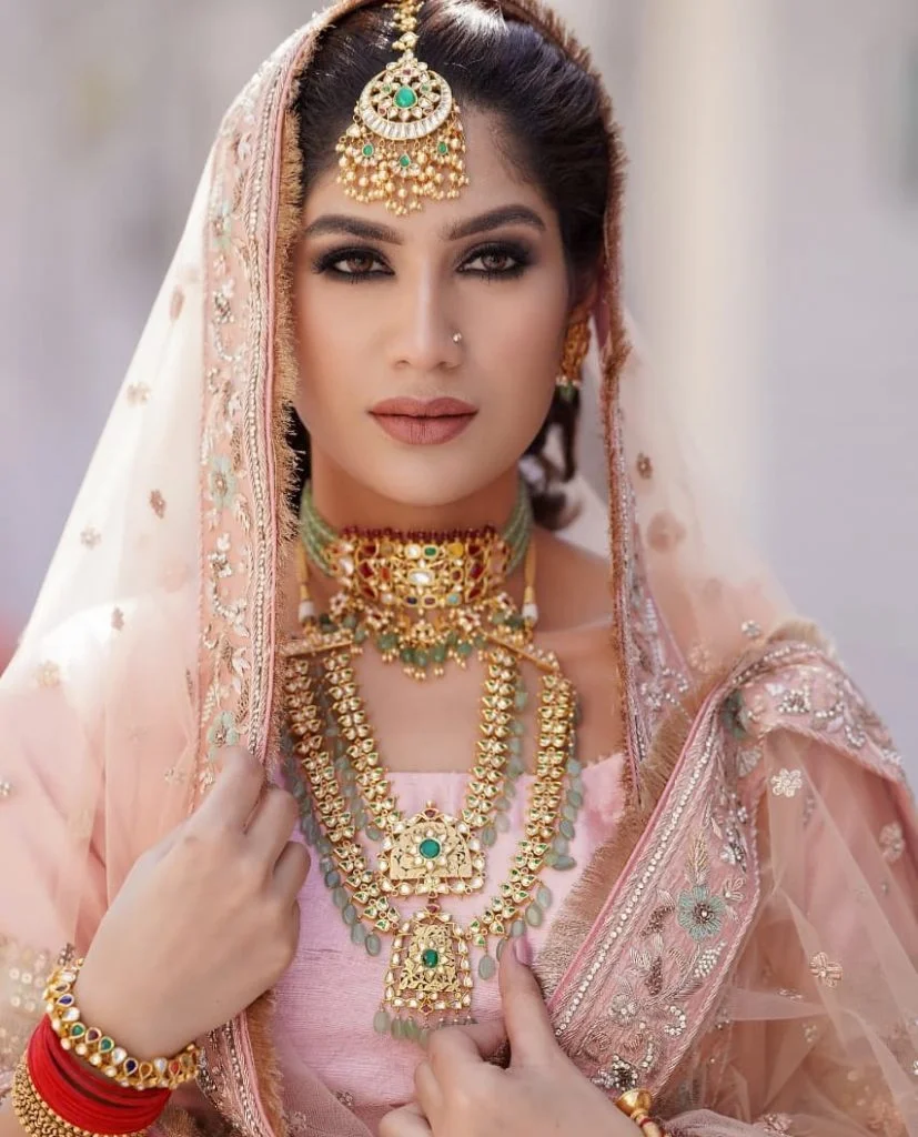 gold and turquoise jewellery with pink sharara