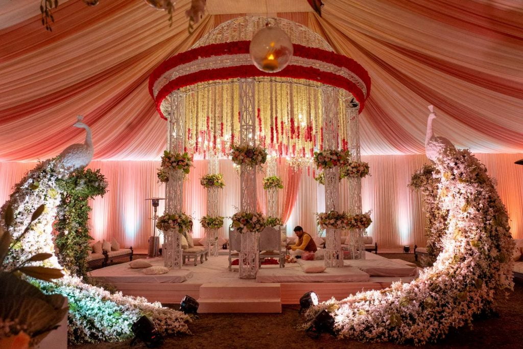 tent shaped mandap with floral peacock statues