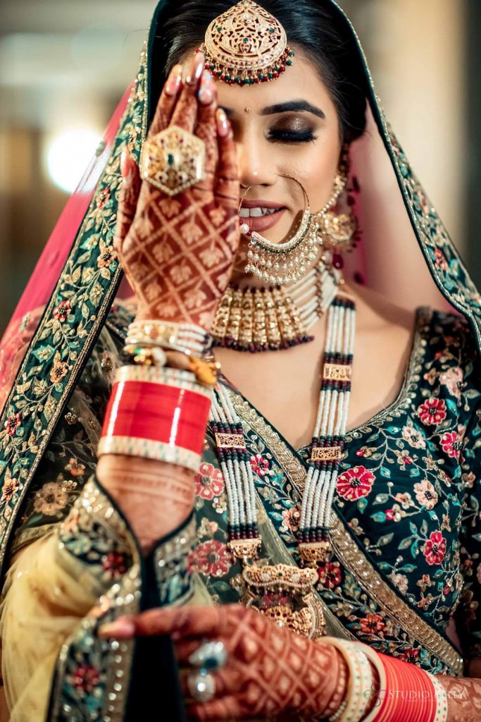 matching green jewellery with green lehenga