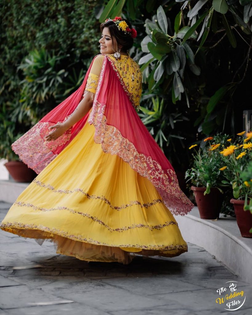 yellow lehenga choli with lace border pink dupatta 