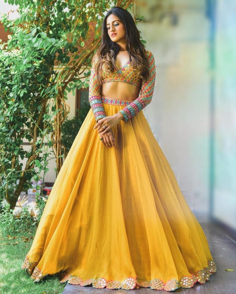 embroidered full sleeves crop blouse with plain yellow long skirt for haldi mehendi function 