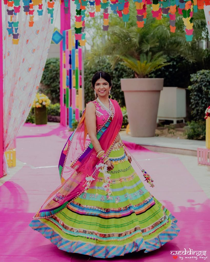 quirky mehendi green striped lehenga and pink choli 