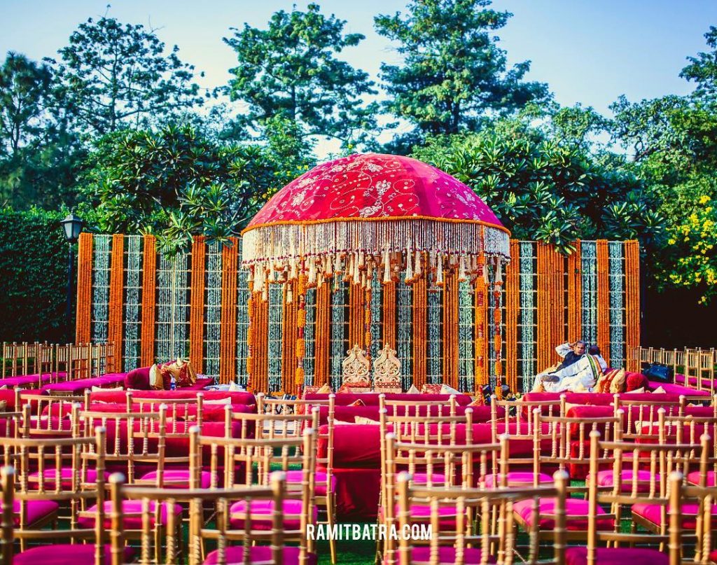 dome shaped mandap design in pink and orange