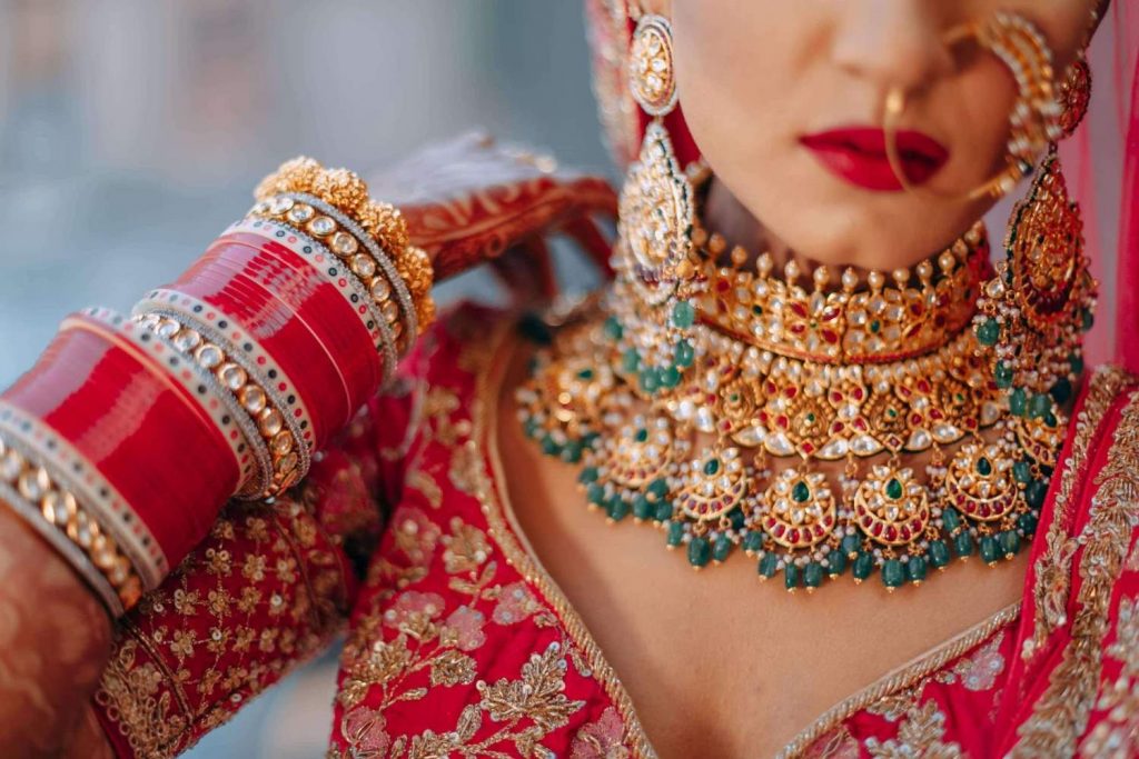 contrast green choker with red lehenga