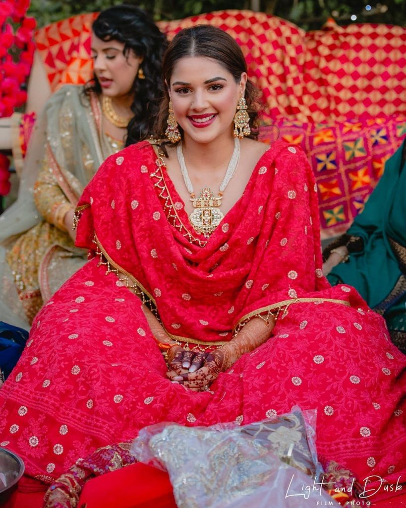 white and gold jewellery with red lehenga