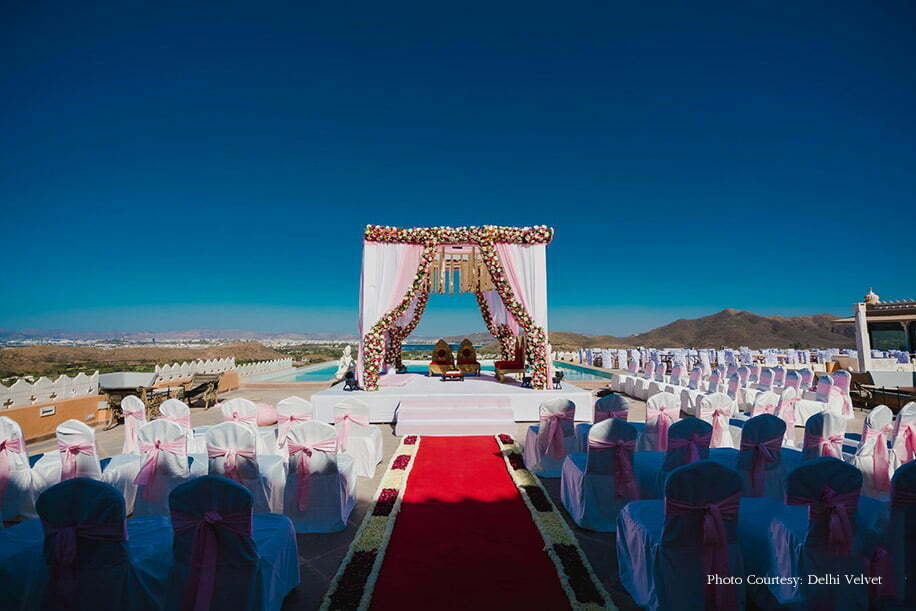 simple wedding mandap with drapes and flower lining