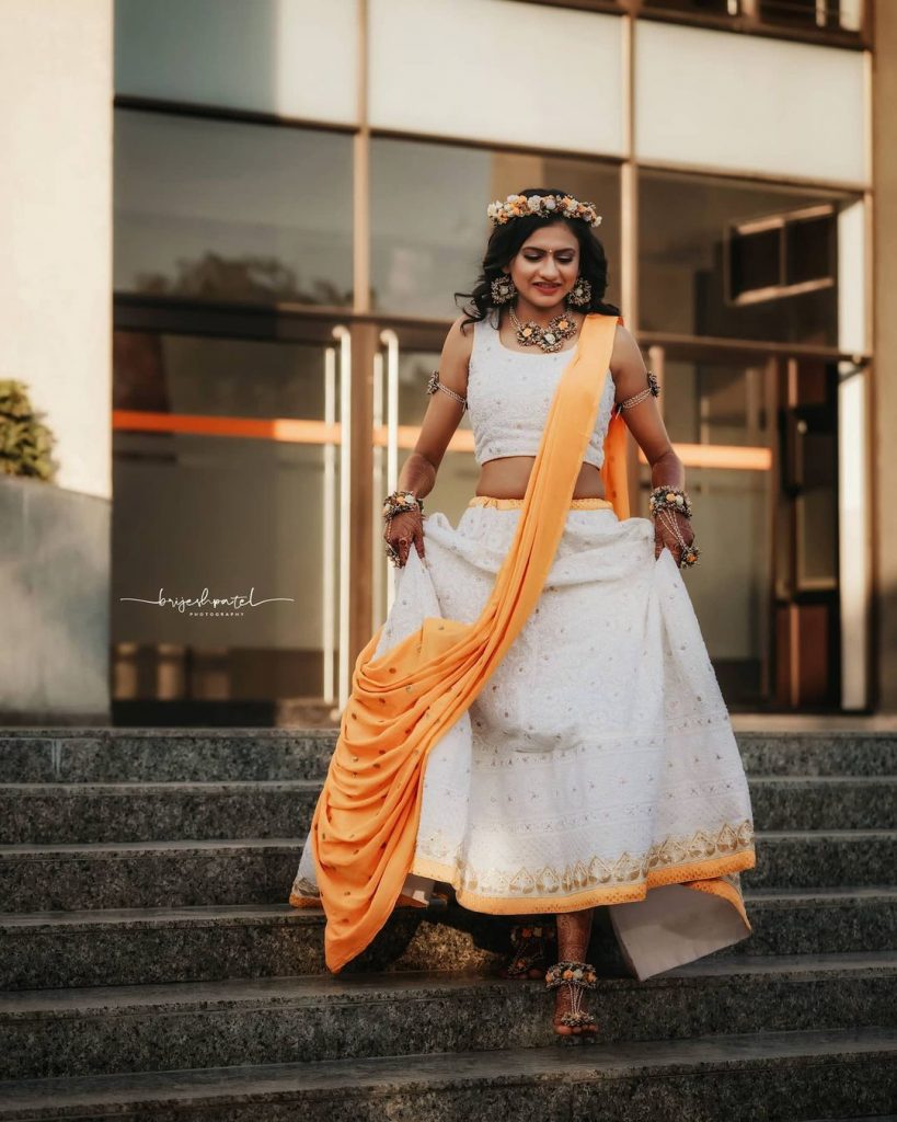 white chikankari lehenga choli with yellow dupatta ideal for haldi and mehendi ceremony bride