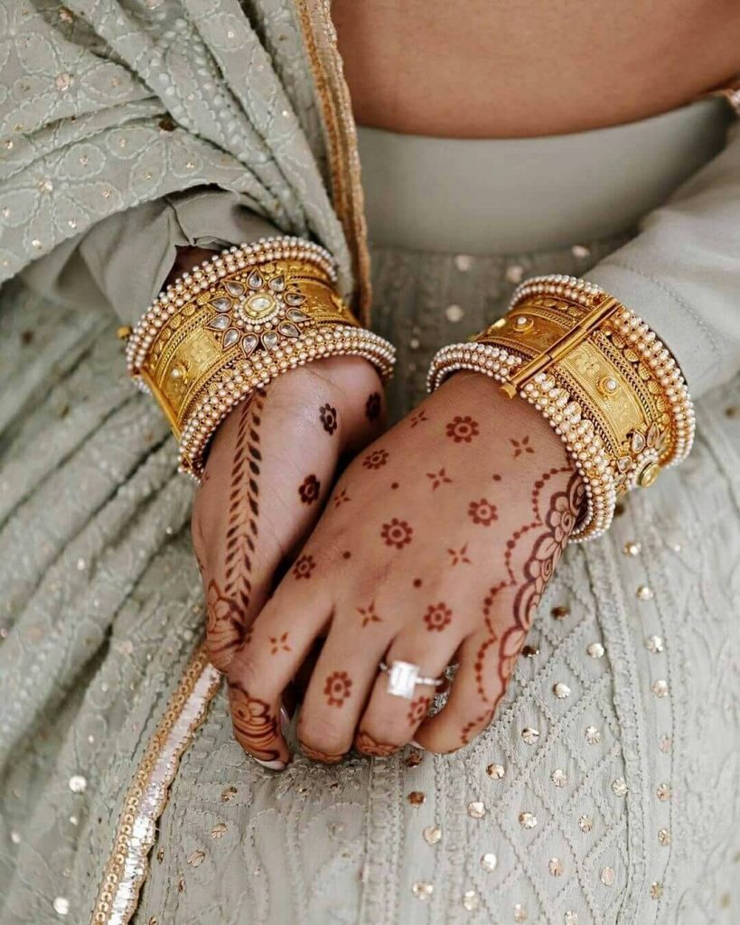 Minimalistic dotwork back hand mehendi design