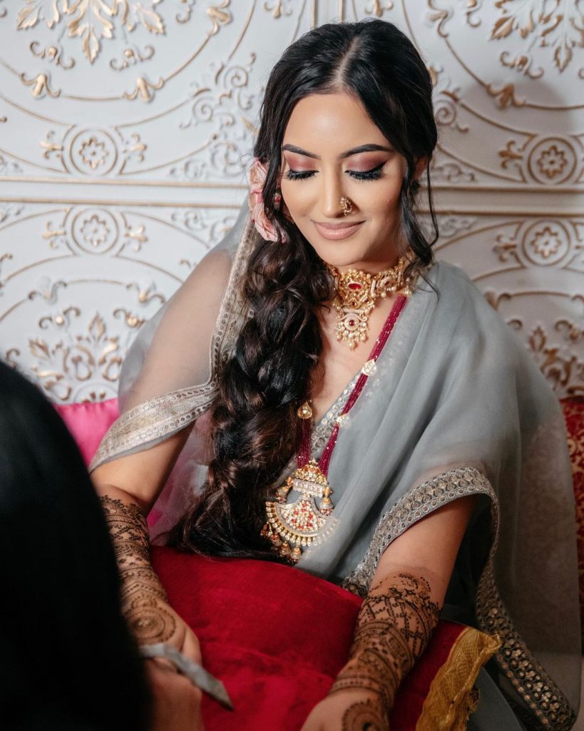 messy puffed up braid as wedding hairstyle for big forehead