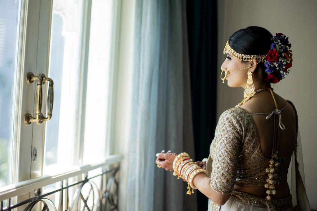 top-knot as indian bridal hairstyle for heart-shaped face