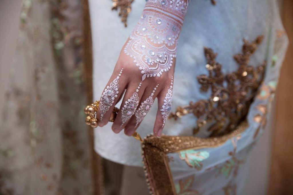 Back hand white mehendi with stones