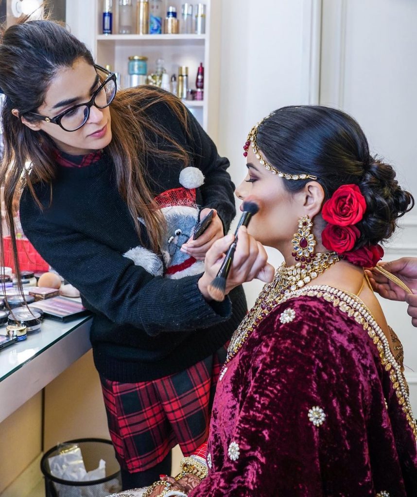 bride getting glammed up with contour and blush from her bridal makeup kit