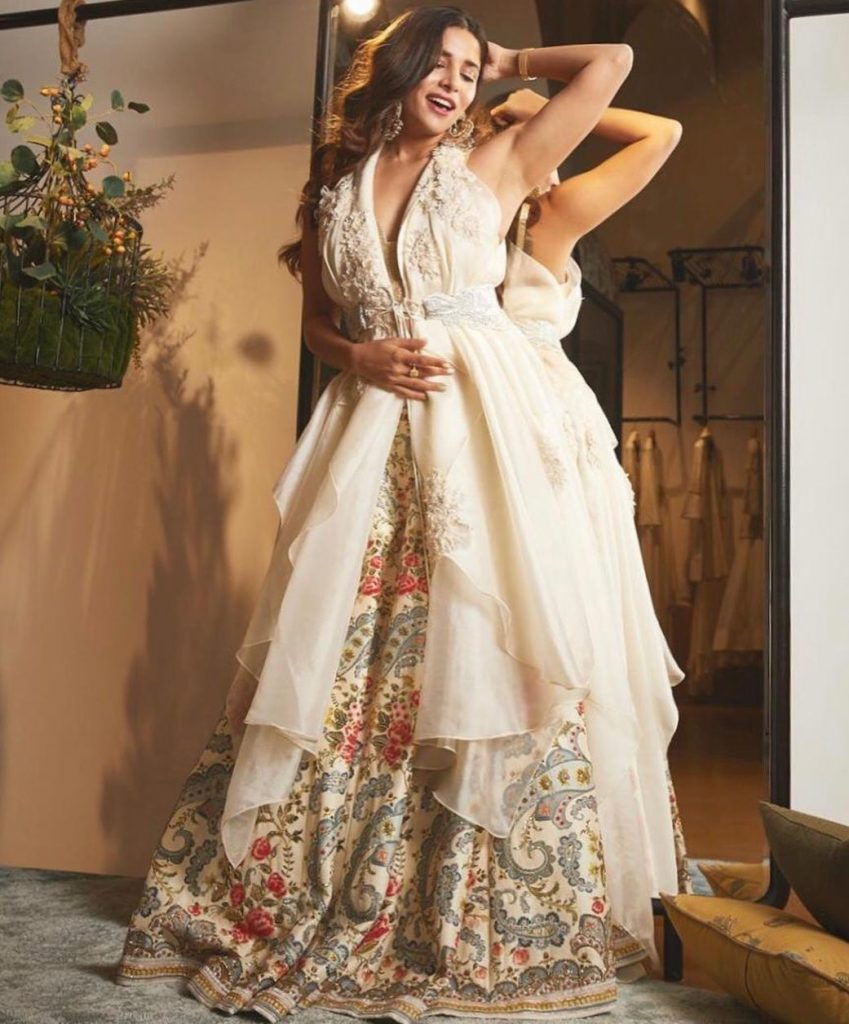 party wear lehenga with long asymmetrical belted white jacket