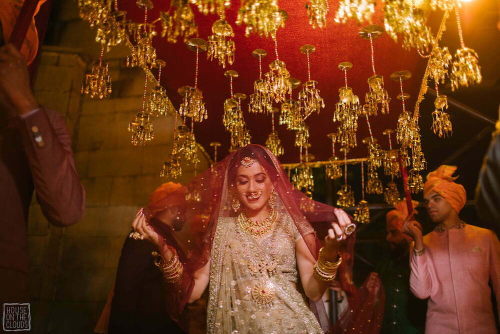 Beautiful bridal entry under a kaleerey chaadar