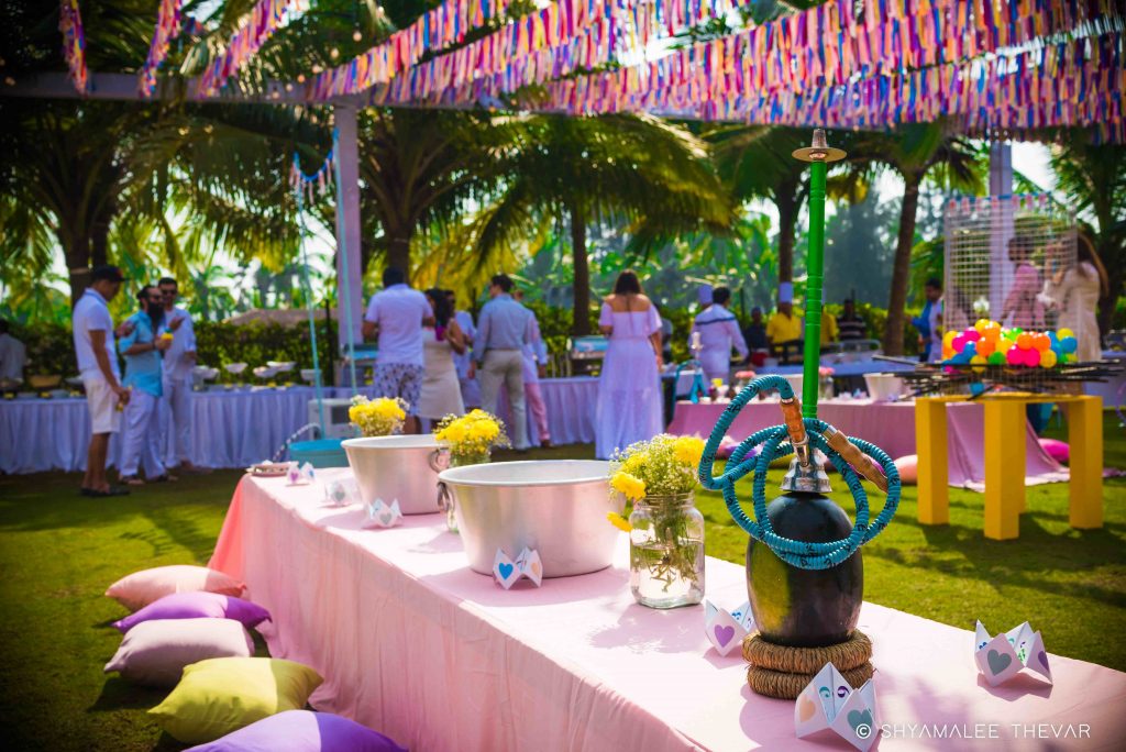 Modern mehndi décor in powder blue and pastel pink with fresh yellow flowers