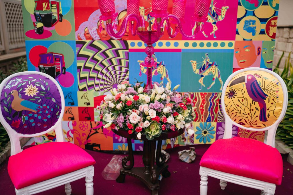 bohemian décor with animal printed chairs and flowers as decorations