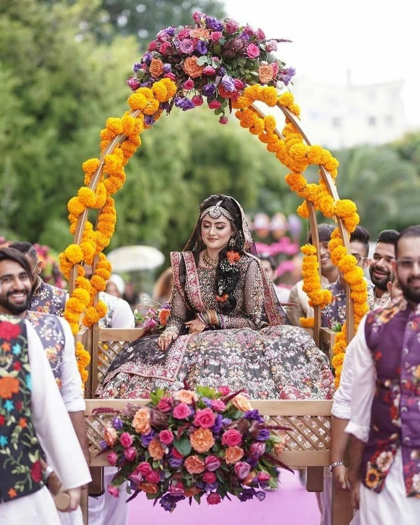 bridal entrance in a flower basket doli