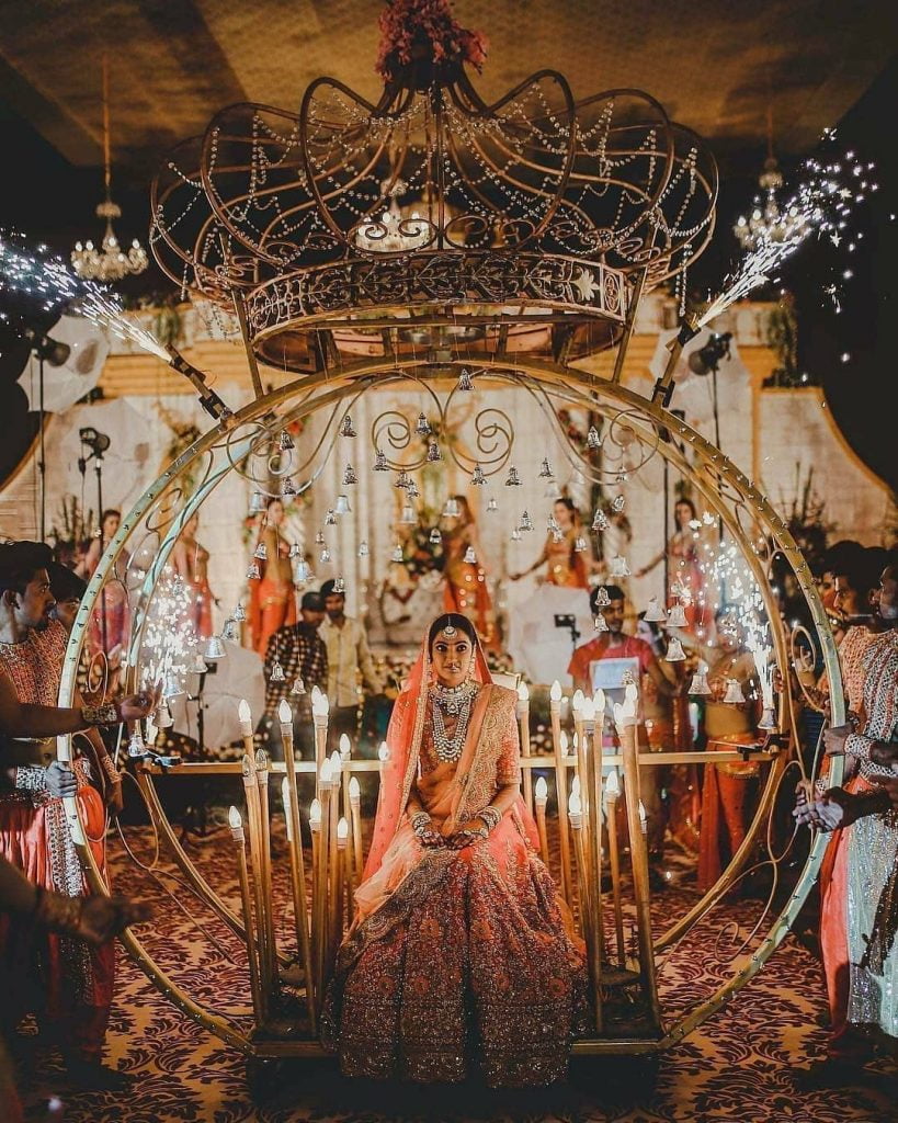 Dreamy bridal entry in a cinderella carriage