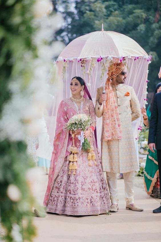 bridal entry with veiled umbrella