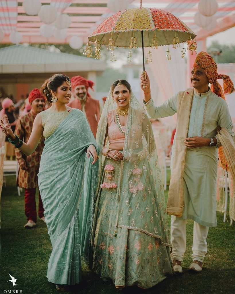 wedding entry under a fabric umbrella