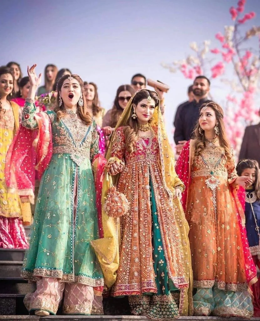 dulhan entry with her bridesmaids in color co-ordinated outfits