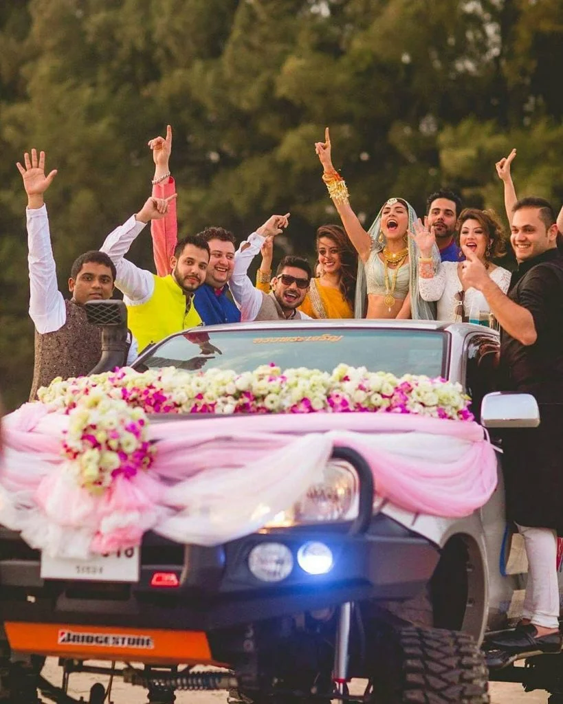 Bride entering with her friends in a car