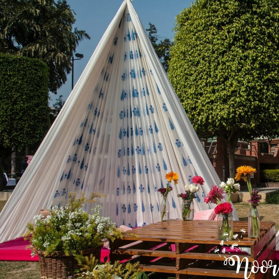 canopy decoration with flowers and vases