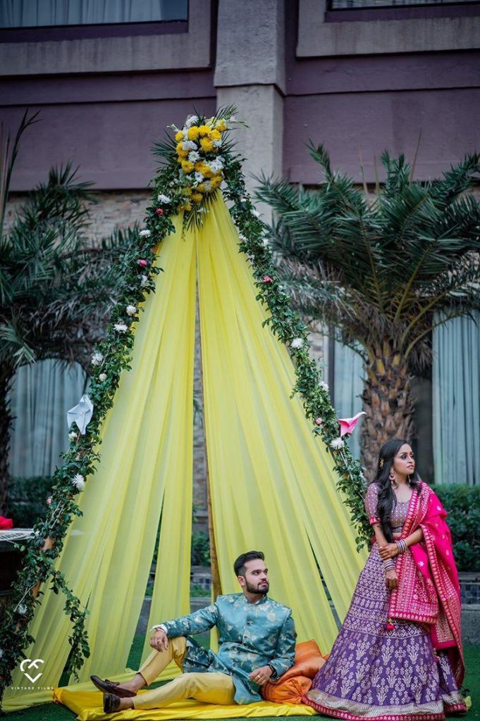 yellow canopy decorated with vines and flowers