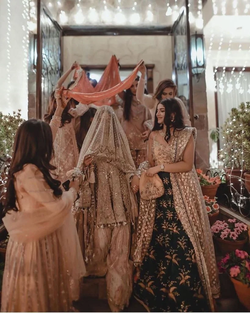 wedding entry with bridesmaids holding your bridal chaadar