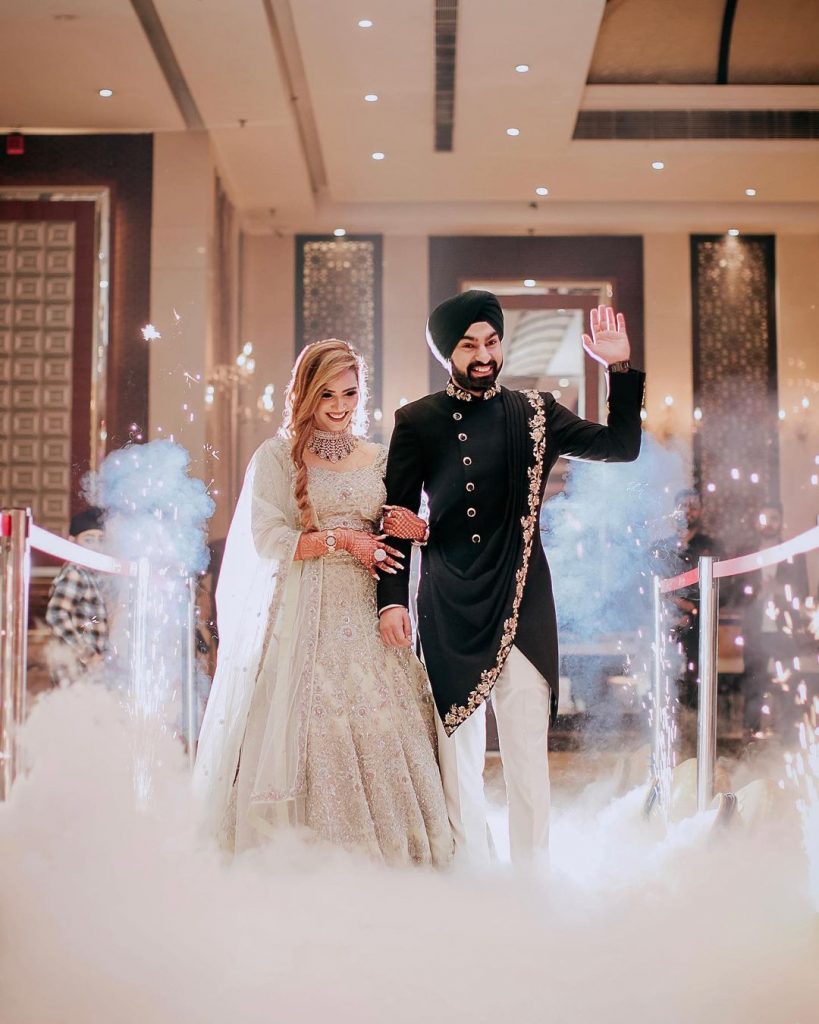 low fog machince bride and groom entry in reception