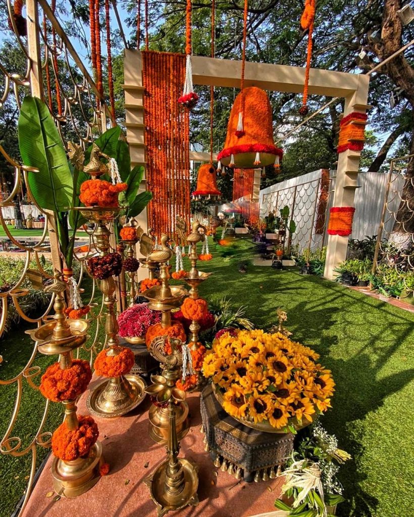 entrance décor with marigolds flowers and gold accessories