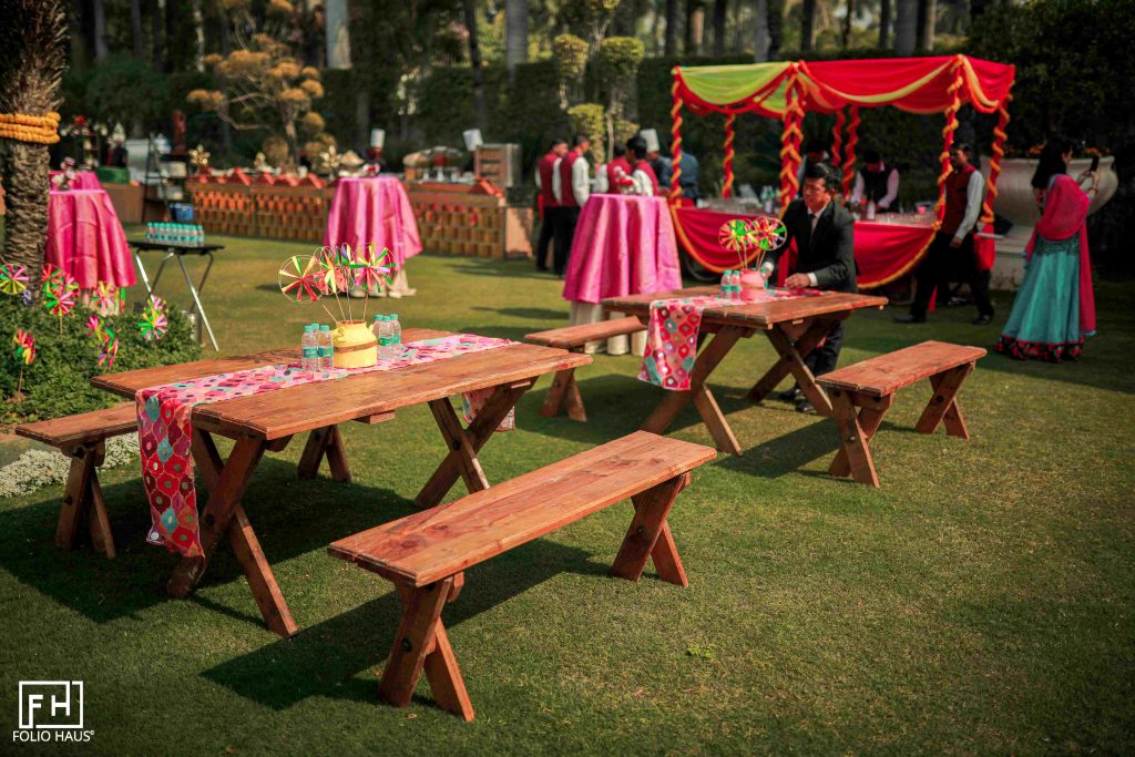mehendi decoration ideas with vibrant colour scheme and pinwheels as table décor