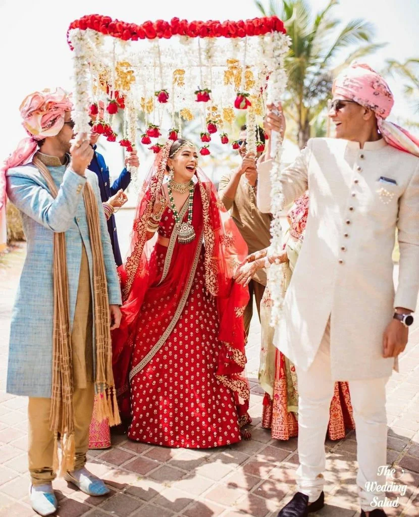 Bridal entry under a flower and kaleera chaadar