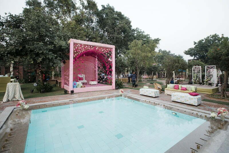 poolside mehendi decorations in pink color scheme