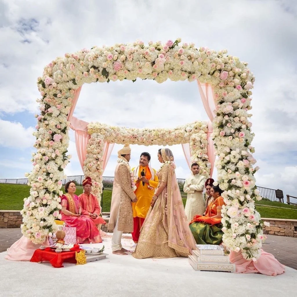 Couple floral mandap hindu marriage date 2021