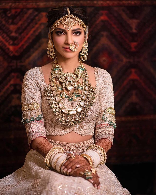 Miheeka Bajaj wearing heavy diamond polki set as her Indian bridal jewelry