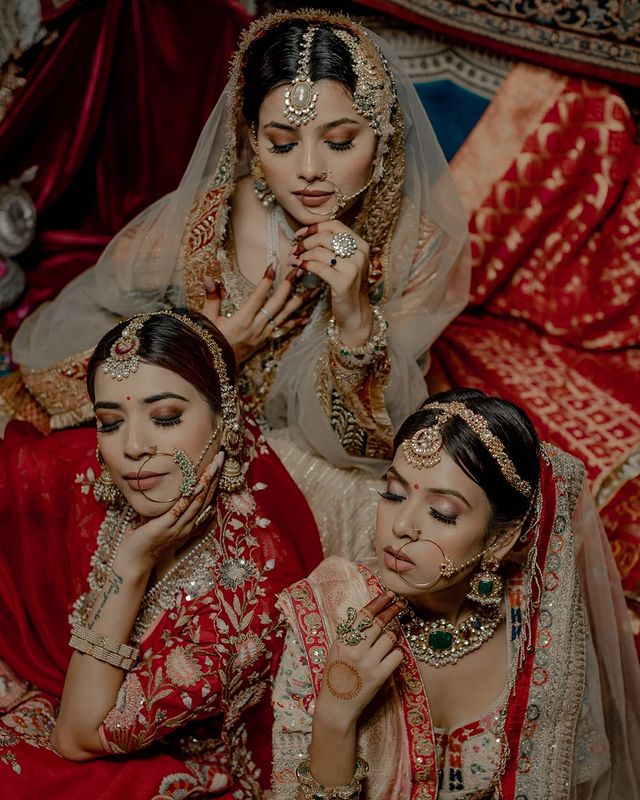 Brides posing in royal mughal indain bridal jewelry