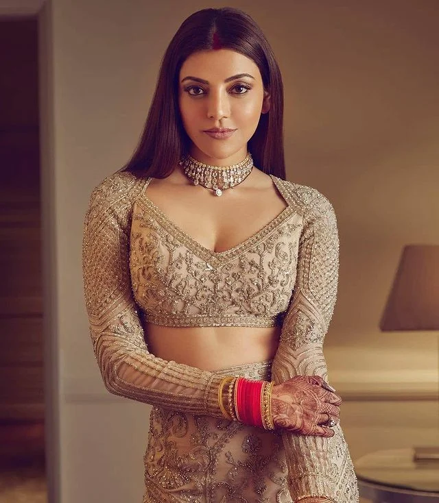 Kajal Aggarwal flaunting her diamond choker necklace with V neckline