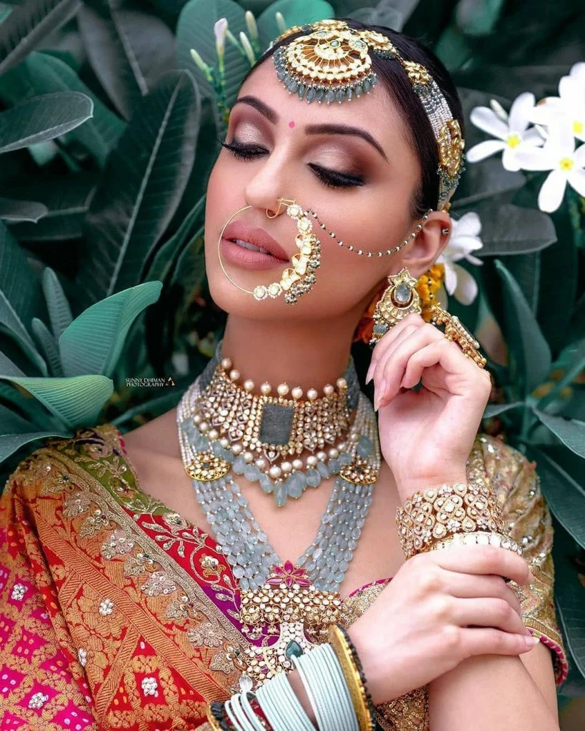 Contrasting grey hued indian bridal jewelry set with red and orange bridal lehenga