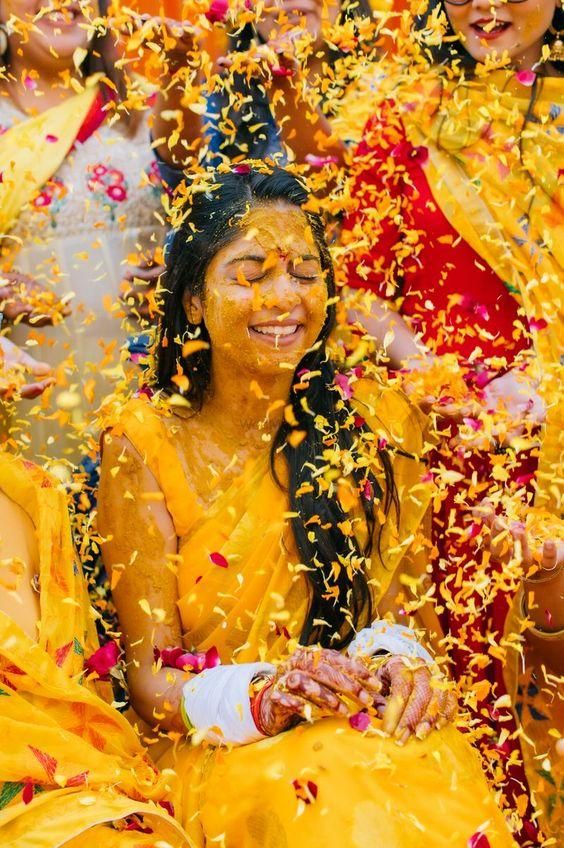 Haldi photoshoot poses flower showering for solo bride