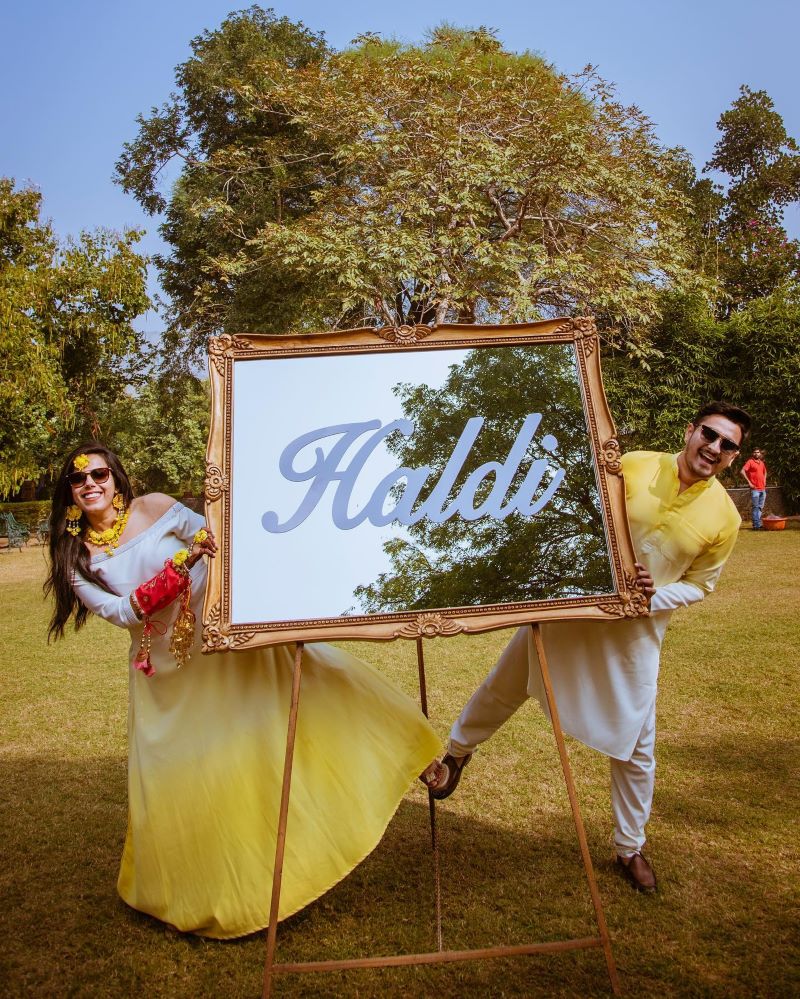 Haldi photoshoot poses for couples with coordinating outfits