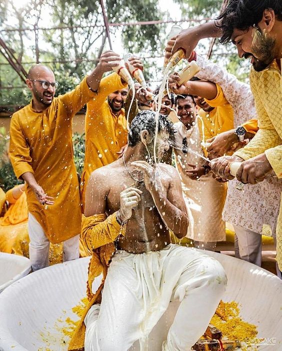 Haldi photoshoot poses for groom with brothers 