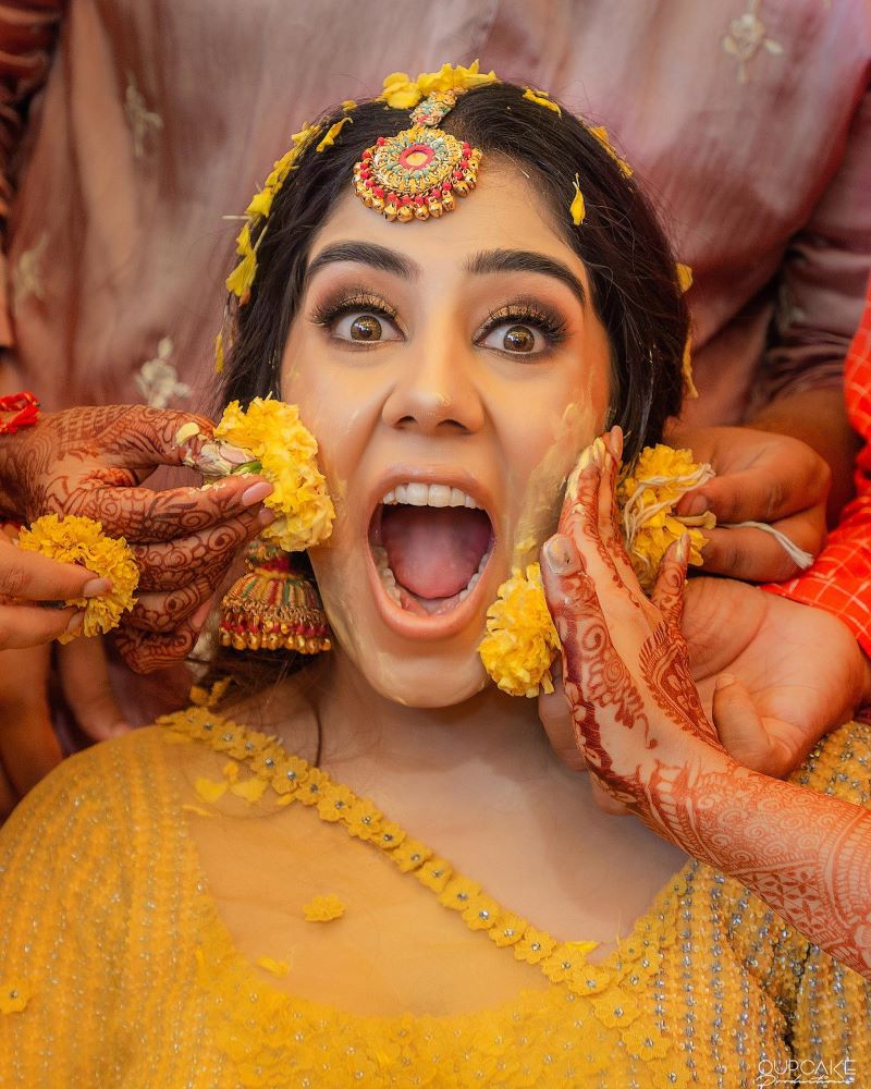 Photo of Unique Pose Idea for Bride and Bridesmaid on Haldi