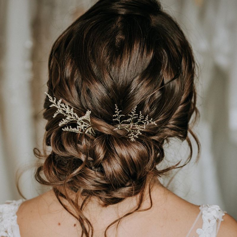 twisted-bun-hairstyle-with-gown-for-medium-hair | WedAbout