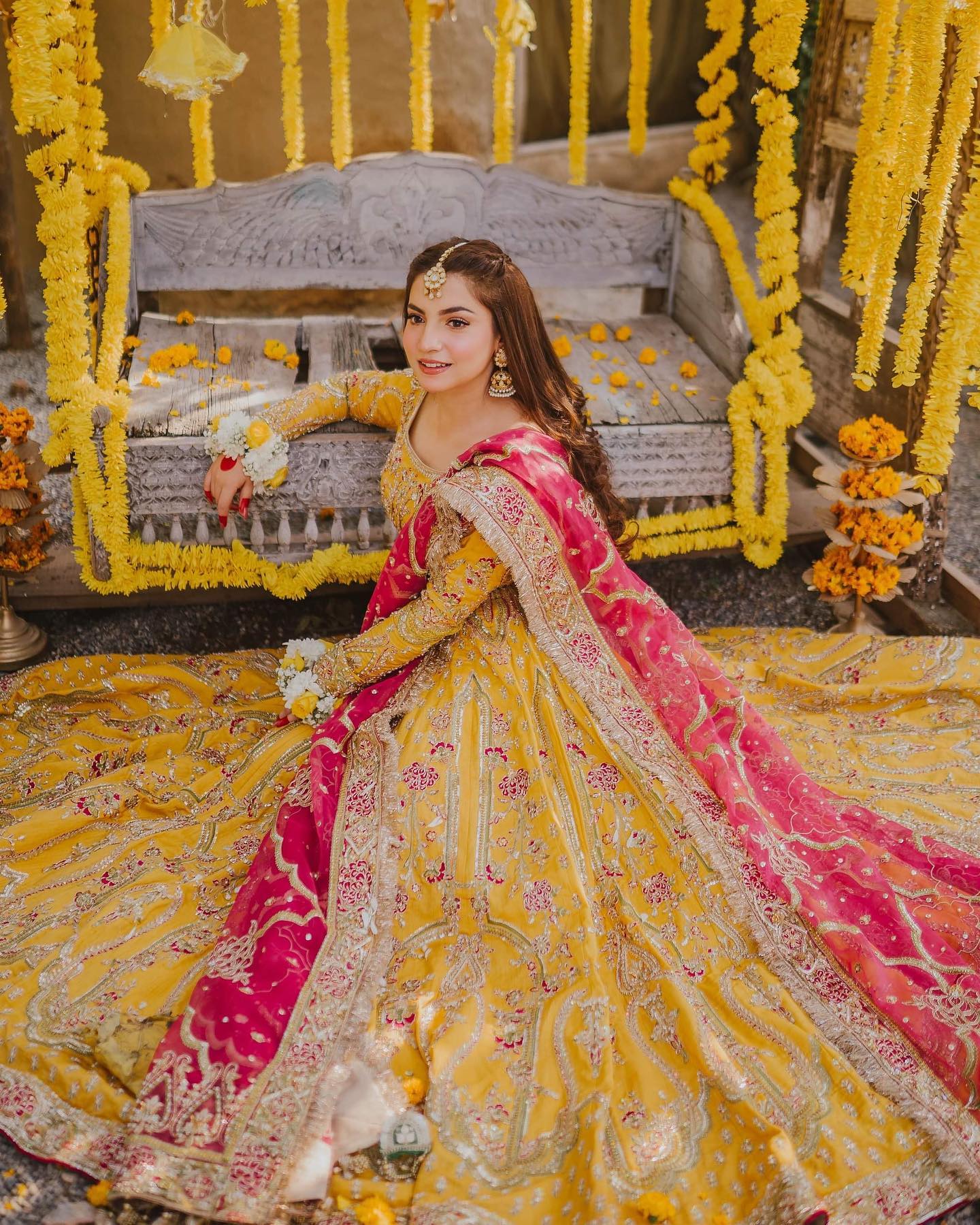 anarkali suit pakistani haldi dress for bride in yellow and pink colour