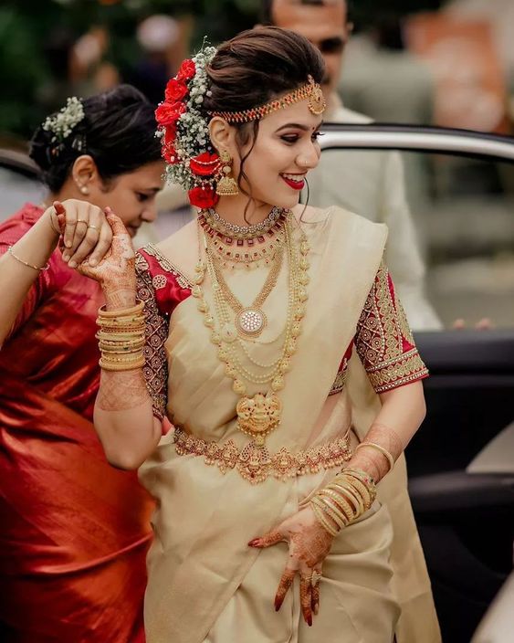 red and cream south indian wedding saree look