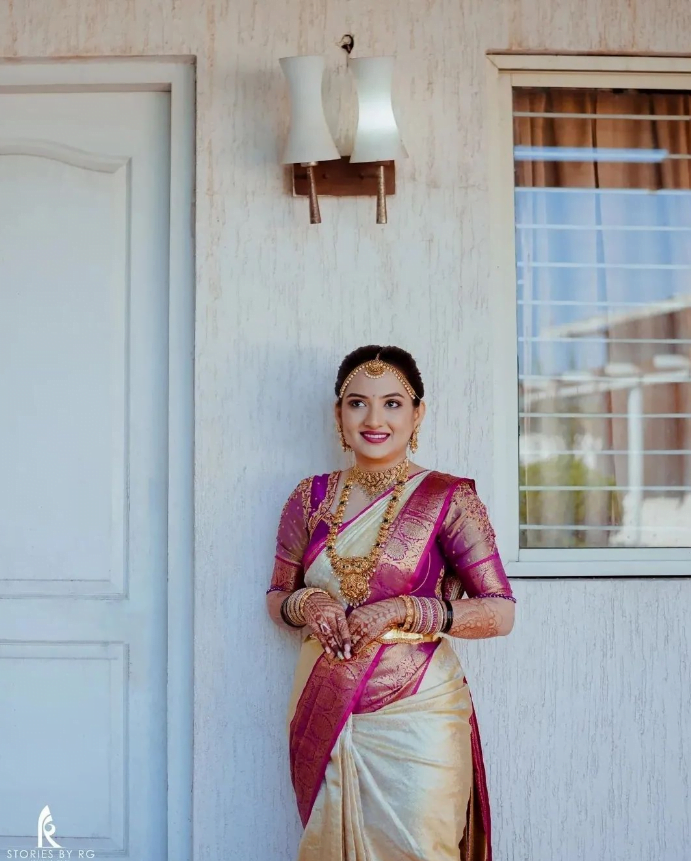Pink and cream South Indian wedding saree look
