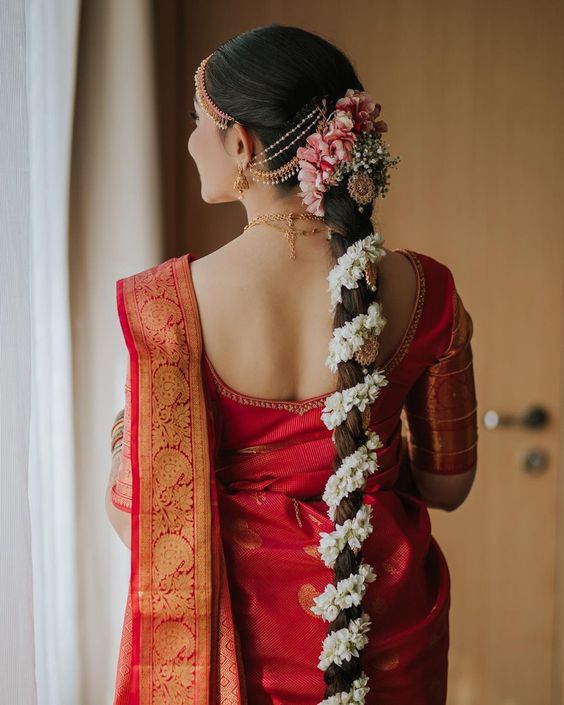 south indian bridal hairstyle with flowers for medium and long hair